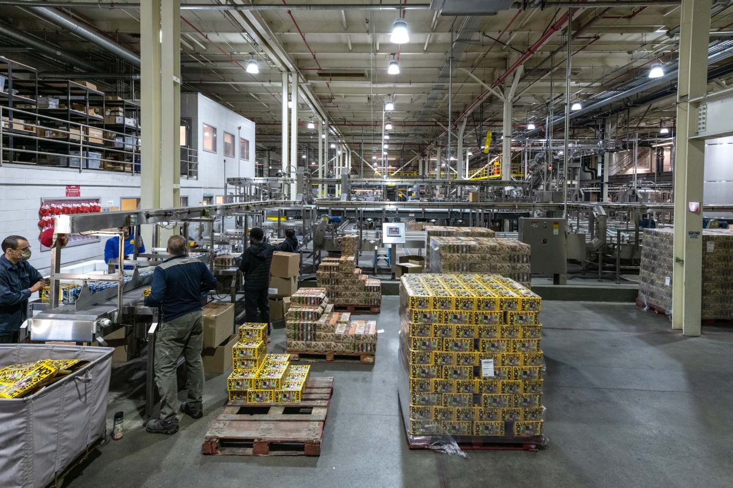 People Sorting Packaged Goods in the End